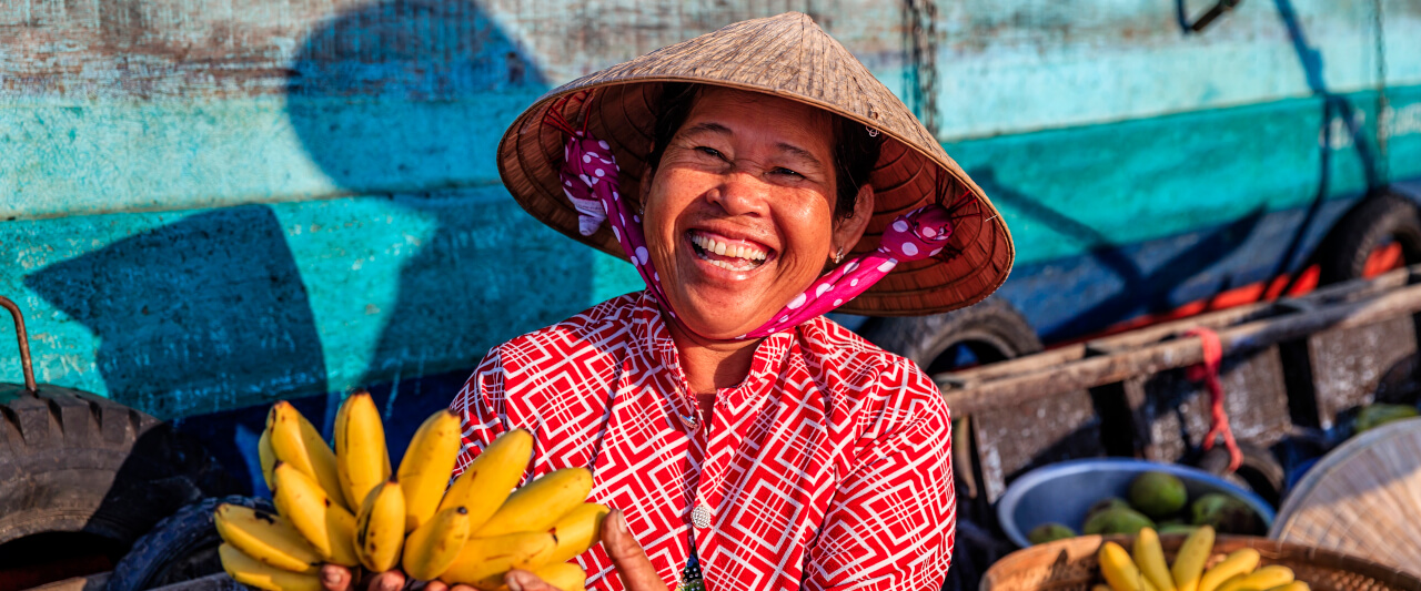 Vietnamesische Frau auf einem schwimmenden Markt | Gebeco